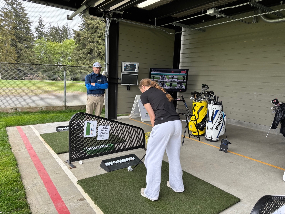 Greg giving a club fitting 