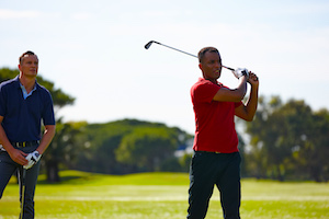 Photo - Golfer hitting ball out of sandtrap